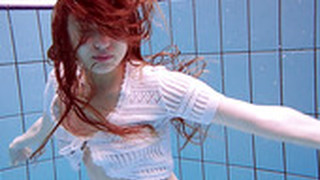 Stunning Red Haired Porn Model Marketa Shows Striptease Under The Water