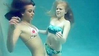 Two Girls Breath Holding And Posing Underwater
